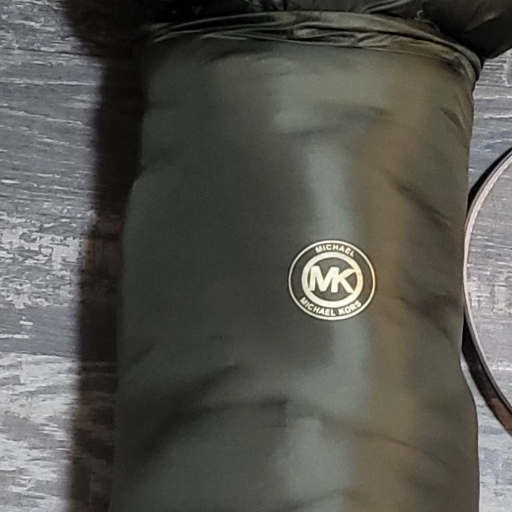 Brand new green Michael Kors jacket that fits in a bag